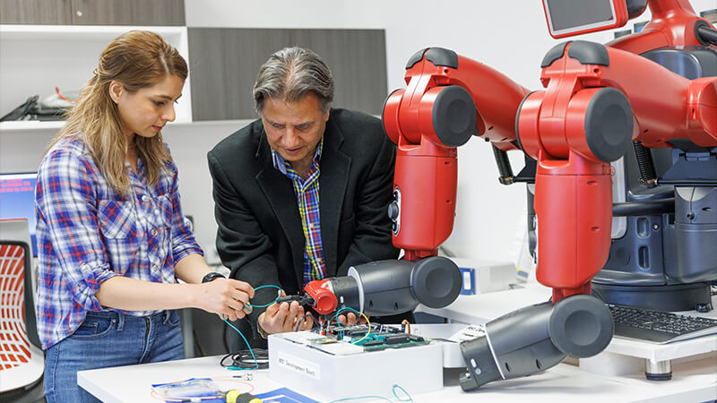 Students working with robotics