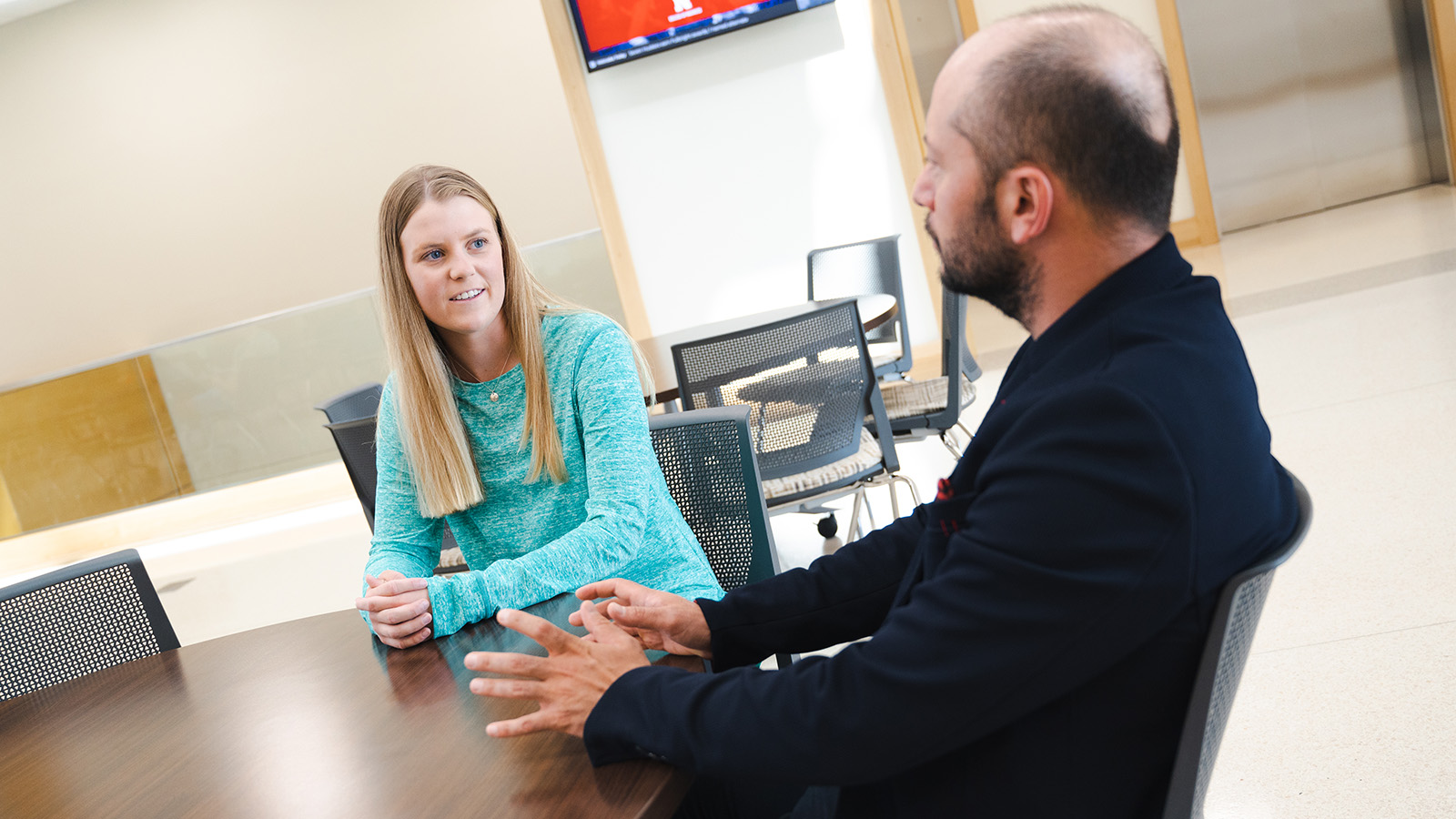 Student and professor talking.