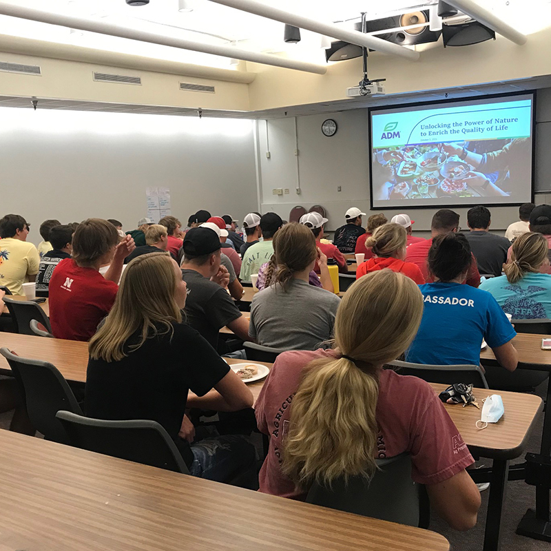 Students in classroom looking at screen