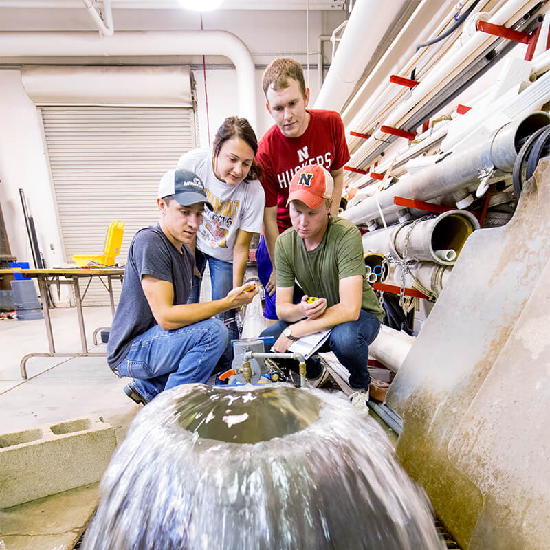 Students working on water flow system