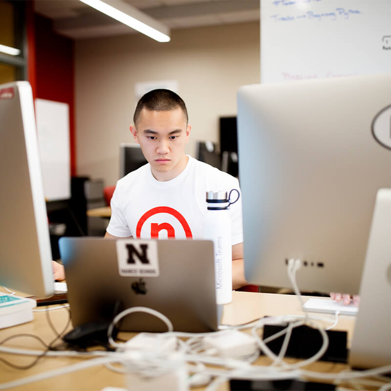 Student works at computer station.