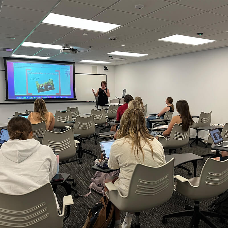 Students listen as professor leads the class in discussion