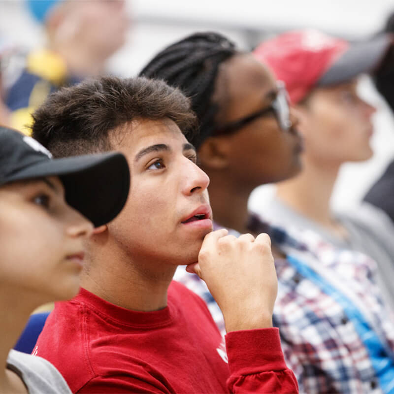 Student looking up from seat in classroom