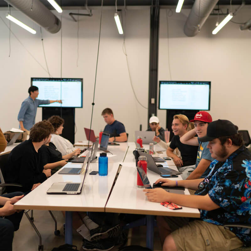 Students at roundtable event working on ideas