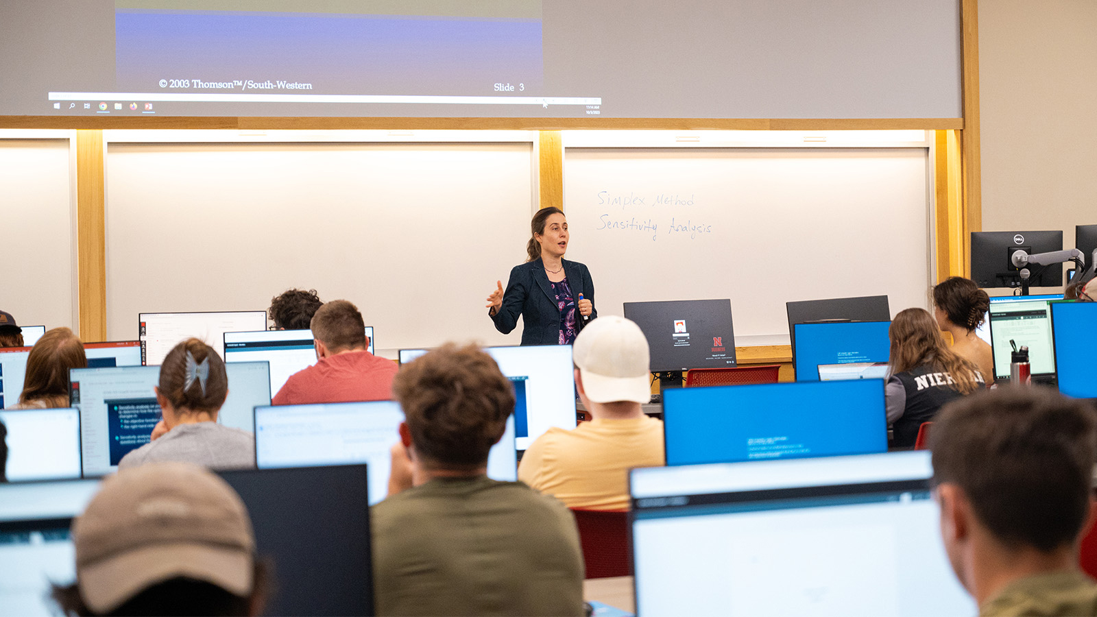 Students in a classroom listening to a lecture.