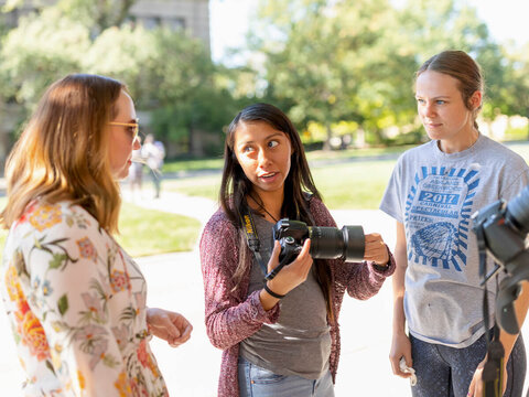 Students taking photos outside