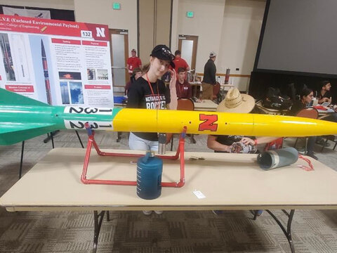 Student displaying a rocket.