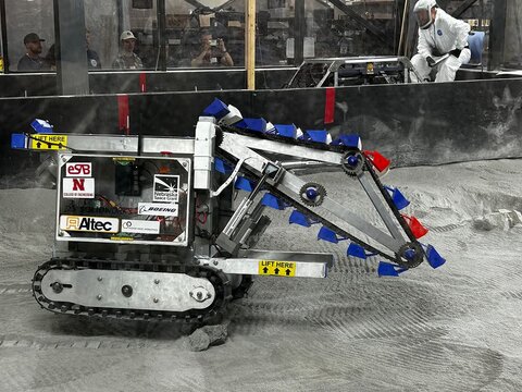 Students watching a robot.